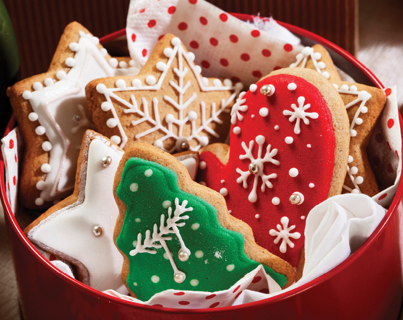 red tin filled with holiday sugar cookies