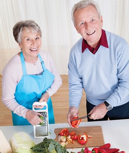 Senior couple making dinner together