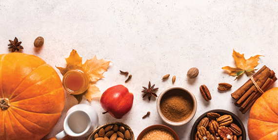 harvest themed foods displayed on table pumpkins nuts cinnamon apples